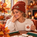 Woman wearing a simple embroidered Mahj Weather cuffed beanie in fall
