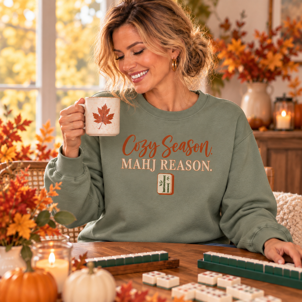 Woman wearing a simple Cozy Season Mahj Reason fall crewneck at game night